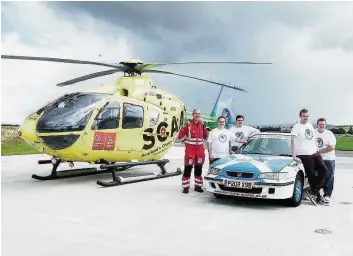  ??  ?? Send-off Pictured with their car at the SCAA base recently are (from left to right) lead aircrew paramedic John Pritchard, Martin Arnold, David Robertson, Scott Shaw and Iain Appleby