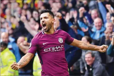  ?? BEN STANSALL/AFP ?? Manchester City striker Sergio Aguero celebrates scoring his third and the team’s fifth goal against Watford at Vicarage Road Stadium in Watford, north of London, on Saturday.