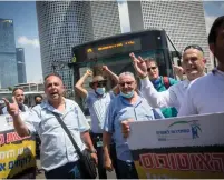  ?? (Miriam Alster/Flash90) ?? BUS DRIVERS block the Azrieli junction in Tel Aviv during a protest yesterday to highlight their precarious work conditions.