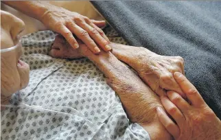  ?? JOHN MOORE/GETTY IMAGES FILES ?? The CMA drafted a document that sets out the terms under which Canadians should qualify for assisted dying and the processes to be followed after a person requests to be put to death.