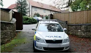  ??  ?? Death threats: A police car at Rebekah Vardy’s mansion yesterday