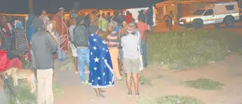  ?? Picture: ZOLILE MENZELWA ?? GRAVE CONCERN: Residents of Joe Slovo informal settlement stand outside after shacks were set alight