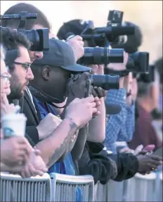  ?? Stephanie Chambers/Post-Gazette ?? Spectators line Fifth Avenue for Dan Rooney's funeral.