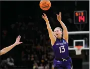  ?? ?? Holy Cross guard Bronagh Power-cassidy (13) shoots a 3-point shot against Iowa in the first half of a firstround college basketball game in the NCAA Tournament, Saturday, in Iowa City, Iowa.