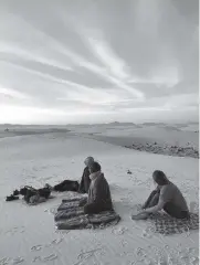  ?? MELANIE RADZICKI MCMANUS Chicago Tribune/TNS ?? Campers catch the sunset on top of the dunes.