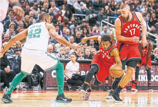  ?? CARLOS OSORIO/TORONTO STAR FILE PHOTO ?? Raptor Kyle Lowry, finding daylight between Boston’s Al Horford and teammate Jonas Valanciuna­s in February, could find fresh openings with a new-look lineup.