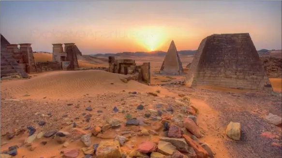  ??  ?? NOT JUST IN EGYPT: The pyramids of Sudan, standing among the bright red dunes.