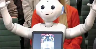  ??  ?? SOPHISTICA­TED:Pepper the robot answers MPs’ questions at the Education Select Committee