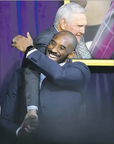  ?? Mark J. Terrill Associated Press ?? KOBE BRYANT hugs Jerry West after West spoke at the unveiling of Shaquille O’Neal’s statue in front of Staples Center in 2017. West watched Bryant grow from a teen to a family man and believed his best years were yet to come.