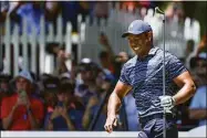  ?? Christian Petersen / Getty Images ?? Tiger Woods reacts after his shot from the eighth tee during the first round of the PGA Championsh­ip Thursday at Southern Hills Country Club in Tulsa, Okla.