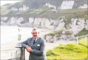  ?? Peter Morrison / Associated Press ?? Darren Clarke poses at Royal Portrush, Northern Ireland, in October 2015. His British Open title was part of the groundswel­l of support that led to Royal Portrush getting the British Open for the first time since 1951.