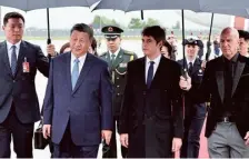  ?? AFP ?? Fresh start: France’s Prime Minister Gabriel Attal, second from right, greets ◣i Jinping at Orly airport, south of Paris on Sunday.