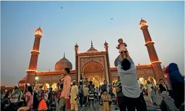  ??  ?? Built between 1644 and 1658, the Jama Masjid towers over the narrow streets of Old Delhi.