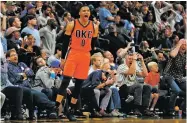  ?? JACK DEMPSEY THE ASSOCIATED PRESS ?? Oklahoma City Thunder guard Russell Westbrook celebrates Sunday after hitting a buzzer beating three-point shot to win the game 106-105 against the Nuggets in Denver. Westbrook also broke the NBA record for triple doubles with 42.