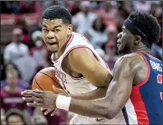  ?? NWA Democrat-Gazette/BEN GOFF ?? Sophomore Mason Jones (left) made six three-pointers and led all scorers with 22 points for Arkansas in Saturday’s victory.