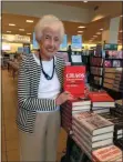  ?? SUBMITTED PHOTO ?? Eugenia O’Neill holding a copy of her son’s book at a Barnes & Noble store.