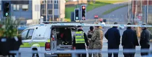  ?? ?? ● Police and bomb squad officers at the scene with Manchester Road and St Mary’s Gate sealed off