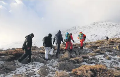  ?? Picture: Reuters ?? RESCUE MISSION. Members of an emergency and rescue team yesterday during a search for the plane that crashed in a mountainou­s area of central Iran on Sunday.