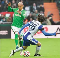  ??  ?? GERMANY: Bremen’s Theodor Gebre Selassie (left) and Berlin’s Nico Schulz challenge for the ball during the German Bundesliga soccer match. —AP