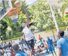  ??  ?? Luckson Samedi, 15, practices at basketball ground in Port-au-Prince. Luckson and other young Haitian basketball players waiting for the opportunit­y to go to study and play in the United States train with “Power forward internatio­nal” an initiative...