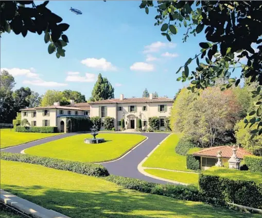  ?? Photograph­s by Mercer Vine ?? THE 10-ACRE HOLMBY HILLS site has a 12,000-square-foot 1936 mansion, whose residents have included Tony Curtis.