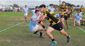  ?? ?? Foxton halfback Tema Tihema slips past a COB defender to score a try in the corner.