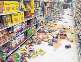  ?? Vincent Nusunginya Associated Press ?? A GROCERY STORE after the earthquake. Many homes and businesses lost power, but there were no reports of significan­t damage, authoritie­s said.