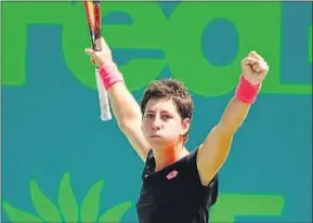  ?? AL BELLO / AFP ?? Carla Suárez celebra su victoria ante Petkovic