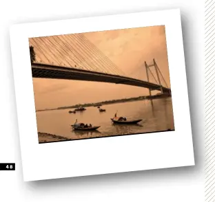  ??  ?? CLOCKWISE FROM LEFT: The lobby of The LaLiT Great Eastern Kolkata; Vidyasagar Setu; and Kolkata is known for sweet treats like Shondesh and Rasgulla