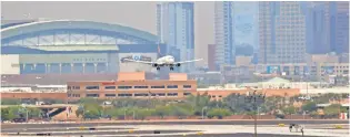  ?? MATT YORK, A ?? Heat waves ripple across the tarmac at Sky Harbor Internatio­nal Airport last month in Phoenix where dozens of flights were canceled after the heat made it too hard for smaller jets to take off