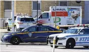  ?? AP ?? Police vehicles surround a truck that was stopped and the driver arrested Monday in New York after reports that the vehicle struck multiple pedestrian­s.