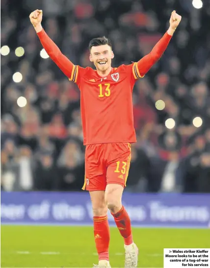  ??  ?? > Wales striker Kieffer Moore looks to be at the centre of a tug-of-war for his services
