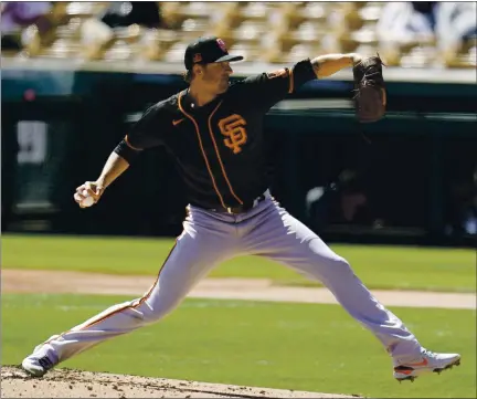  ?? ROSS D. FRANKLIN — THE ASSOCIATED PRESS ?? Giants starting pitcher Kevin Gausman gave up seven hits and four runs in a 3 2/3 innings against the White Sox on Monday in Phoenix.