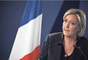  ?? LIONEL BONAVENTUR­E, AFP/GETTY IMAGES ?? Presidenti­al hopeful Marine Le Pen has assailed “radical Islam” and wants to curb immigratio­n.