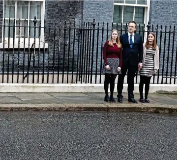  ?? ?? Defiant to the end: Watched by Liberty, 13, Mr O’Leary and Frances, 16, Miss Truss delivers her farewell speech