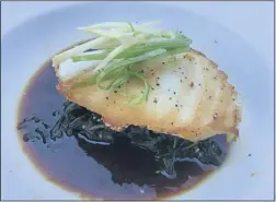  ?? MARK MESZOROS — THE NEWS-HERALD ?? The Chilean Seabass entree is a specialty of the chef at the Cleveland location of Lindey’s Lake House.