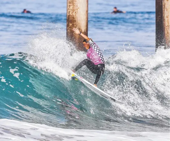  ?? Picture: AAP ?? Sally Fitzgibbon­s beat her rivals and the pier pressure to advance to the quarters at Huntington Beach, California yesterday.