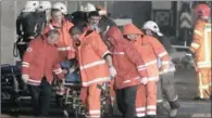  ?? PICTURE: REUTERS ?? VICTIM: Paramedics use a stretcher to move a body from a collapsed supermarke­t in Riga, Latvia, yesterday.
