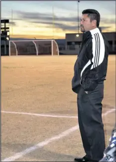  ?? COURTESY PHOTO ?? The sun sets as Central Union girls soccer coach Ramon Lopez stands on the sidelines in this 2012 photo.