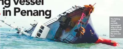  ??  ?? The fishing vessel partially submerged after it hit an artificial reef yesterday. No one was hurt.
