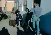  ??  ?? (Below) Ayanda and his mother getting filmed for a documentar­y on his son’s fledgling career.