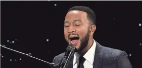  ?? WILLY SANJUAN/INVISION/AP ?? John Legend, performing at the Alliance for Children’s Rights’ dinner in Beverly Hills, Calif in March 2020, is returning to the road in 2021.