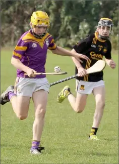  ??  ?? Cathal Whelan (St. Patrick’s) is watched by Adamstown’s Conor Curtis.