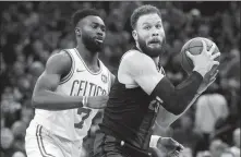  ?? AP ?? Blake Griffin in possession for the Detroit Pistons as Jaylen Brown of the Boston Celtics defends during an NBA game on Feb 13.