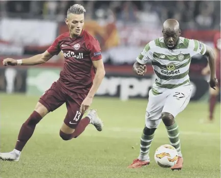  ??  ?? Youssouf Mulumbu breaks clear of Salzburg’s Hannes Wolf during Celtic’s Europa League defeat in Austria on Thursday night.