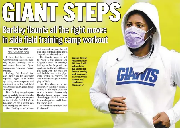  ?? AP ?? Saquon Barkley, recovering from ACL tear, is still not ready for live action, but the star running back looks good in workout with trainers and coaches on Thursday.