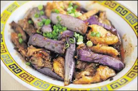  ?? PHOTOS BY BECKY STEIN PHOTOGRAPH­Y ?? Chong Qing Hot Pot serves braised fish filet with eggplant with garlic sauce.