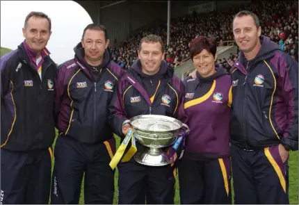  ??  ?? Gerry McQuaid (right) with fellow All-Ireland camogie-winning mentors Joe Brennan, Tommy Roche, J.J. Doyle and Geraldine Murphy after completing the three-in-a-row of Senior successes in 2012.