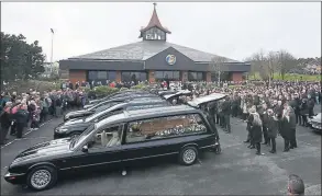  ??  ?? Hearses arrive at the Holy Family Church, Ballymagro­arty in Londonderr­y for the funeral of the five people killed when their car slid off a slipway
