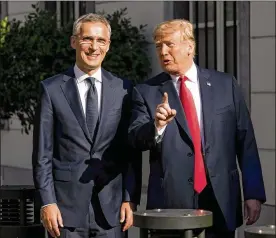  ?? DOUG MILLS / THE NEW YORK TIMES ?? President Donald Trump escorts NATO Secretary General Jens Stoltenber­g into the U.S. Embassy in Brussels on Wednesday.